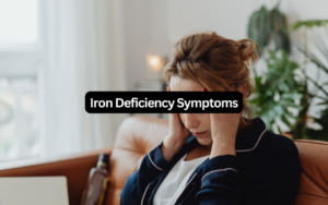 Woman experiencing headache and fatigue as common iron deficiency symptoms