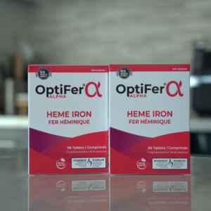 Two boxes of OptiFer Alpha heme iron tablets, 11 mg elemental iron, standing on a kitchen counter